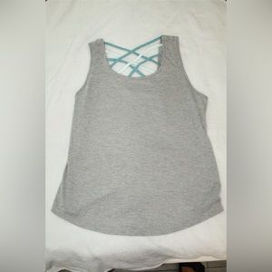 Grey tank with Teal crosses in the back. Loose fitted Athletic Shirt. Size: M